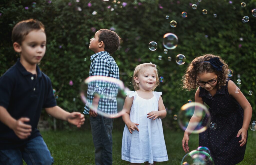 Children playing together, showcasing the social and emotional benefits of play in childhood development.