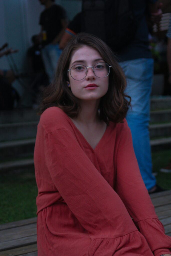 A teen sitting alone, looking downcast or overwhelmed, illustrating the emotional struggle of depression in adolescents.