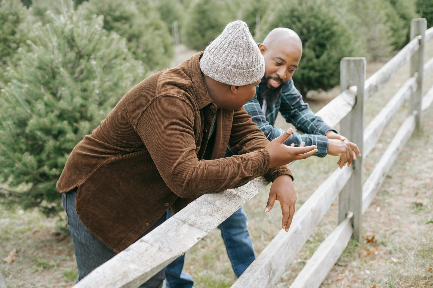 A parent and teen sitting together, having an honest and compassionate conversation about therapy.