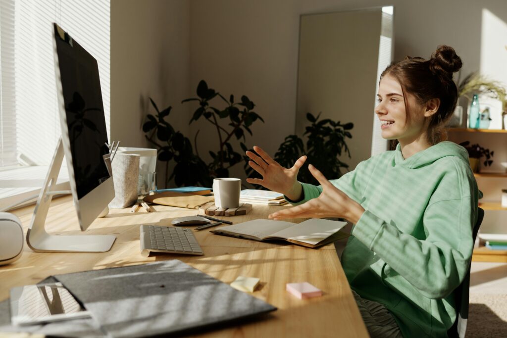 A teen sitting with a therapist in a calm setting, learning DBT skills for emotional regulation and coping.