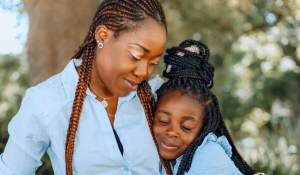 A parent and teen having an open conversation in a safe, supportive space about mental health.