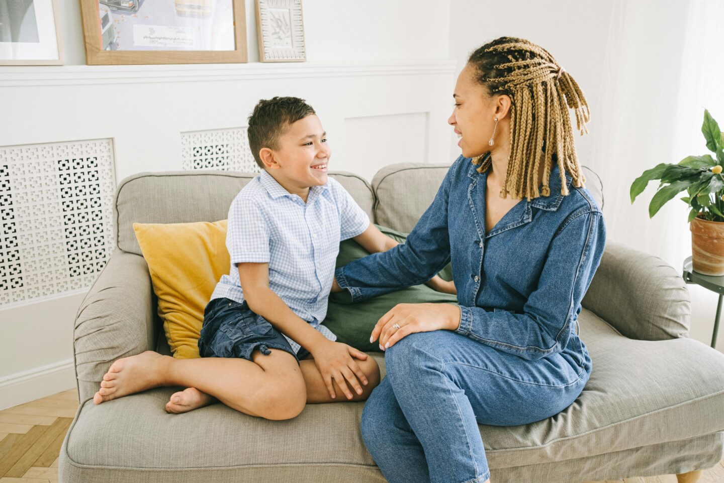 A parent and teen sitting together having an open and supportive conversation about relationships.