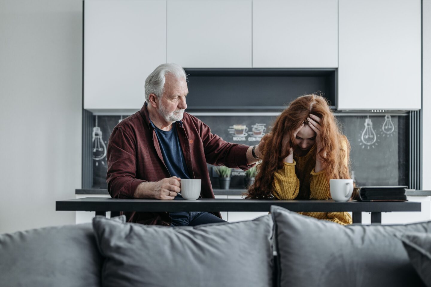 Parent talking supportively with teen about mental health.